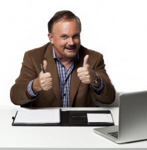 Kozzi-happy_mature_businessman_showing_thumbs_up-3710x5565